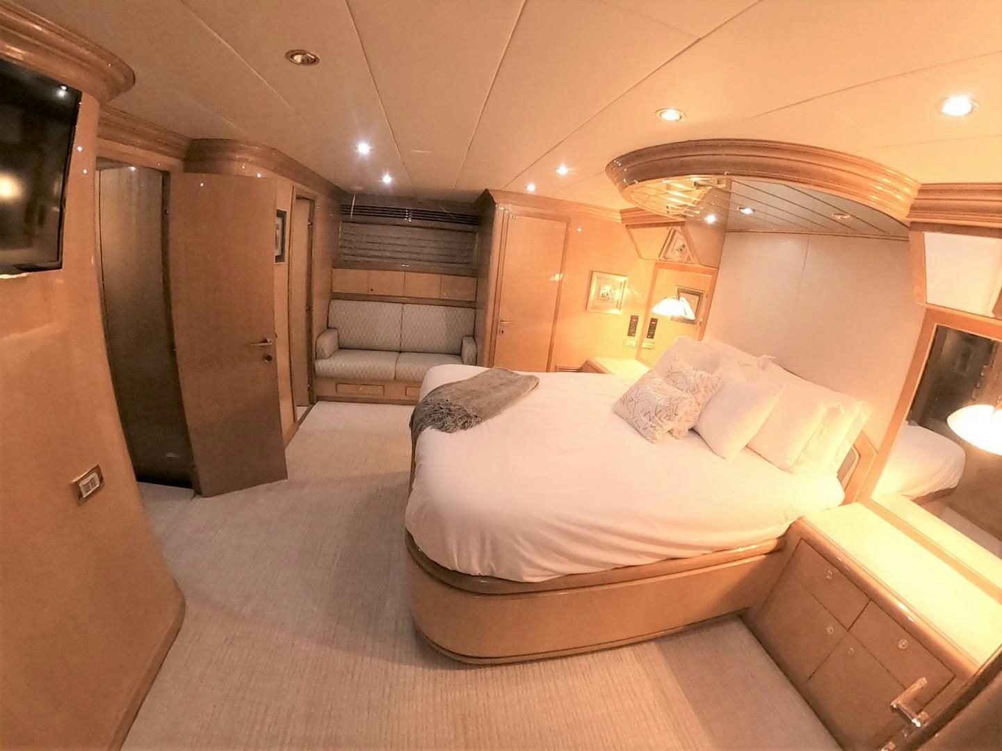 a bedroom with a bed and a closet aboard SEAS THE DAY Yacht for Sale