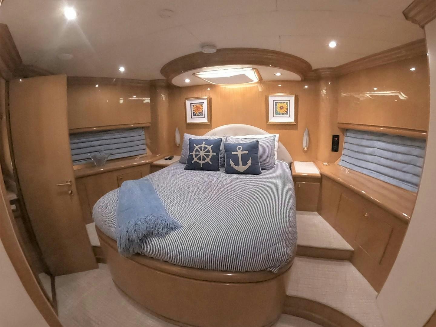 a room with a bed and a window aboard SEAS THE DAY Yacht for Sale