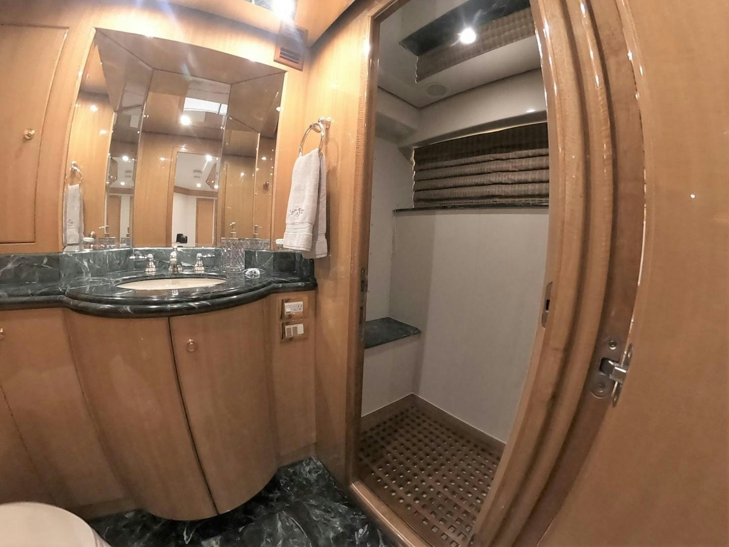 a bathroom with a sink and a mirror aboard SEAS THE DAY Yacht for Sale