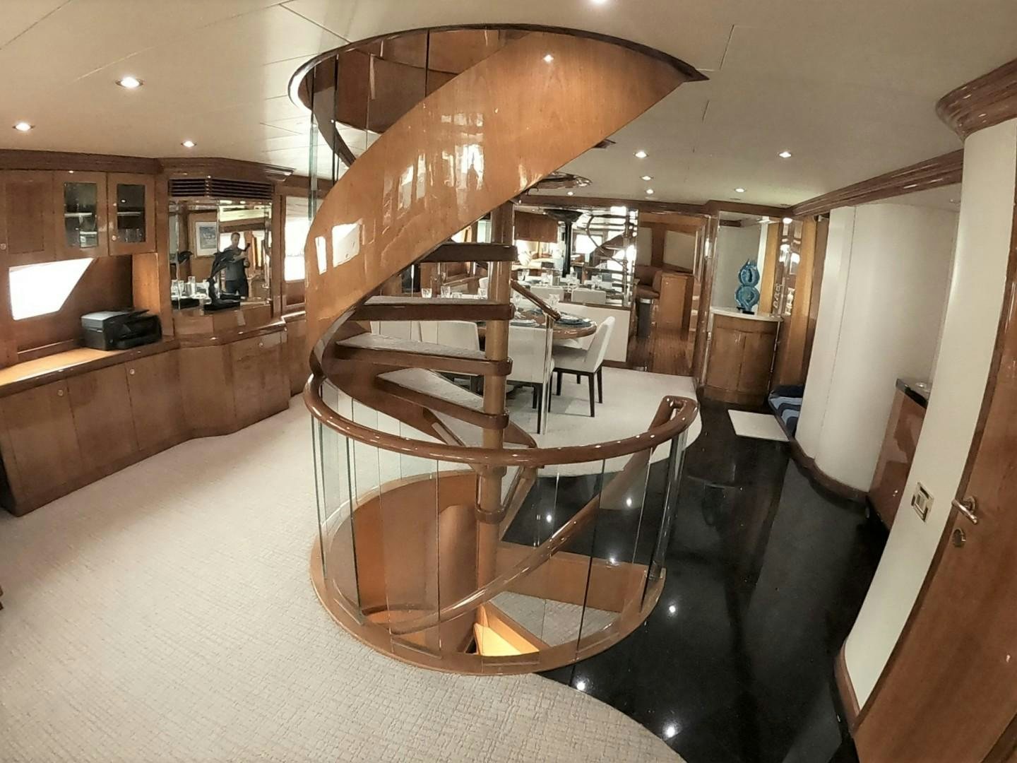 a large wooden piano in a room aboard SEAS THE DAY Yacht for Sale