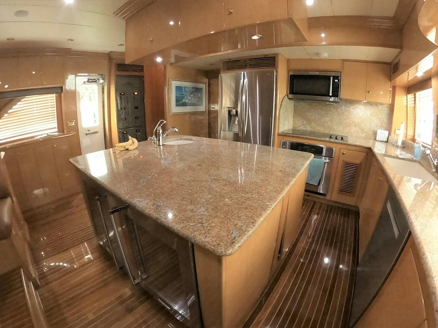 a kitchen with a marble counter top aboard SEAS THE DAY Yacht for Sale