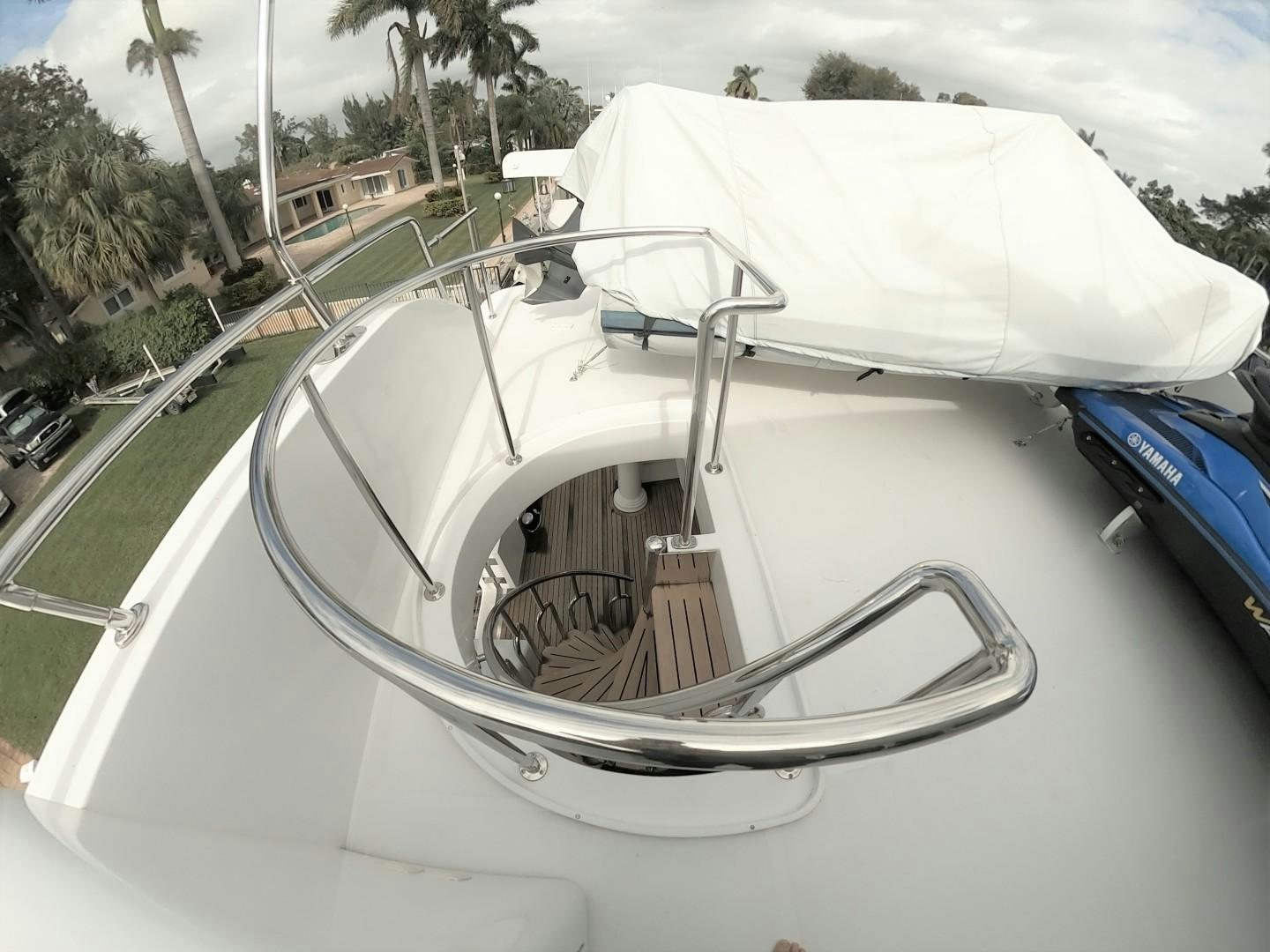 a white car with a canopy aboard SEAS THE DAY Yacht for Sale