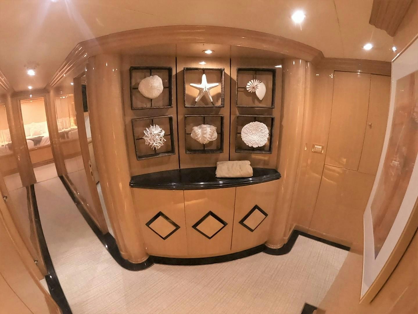 a wood cabinet with a black lid aboard SEAS THE DAY Yacht for Sale