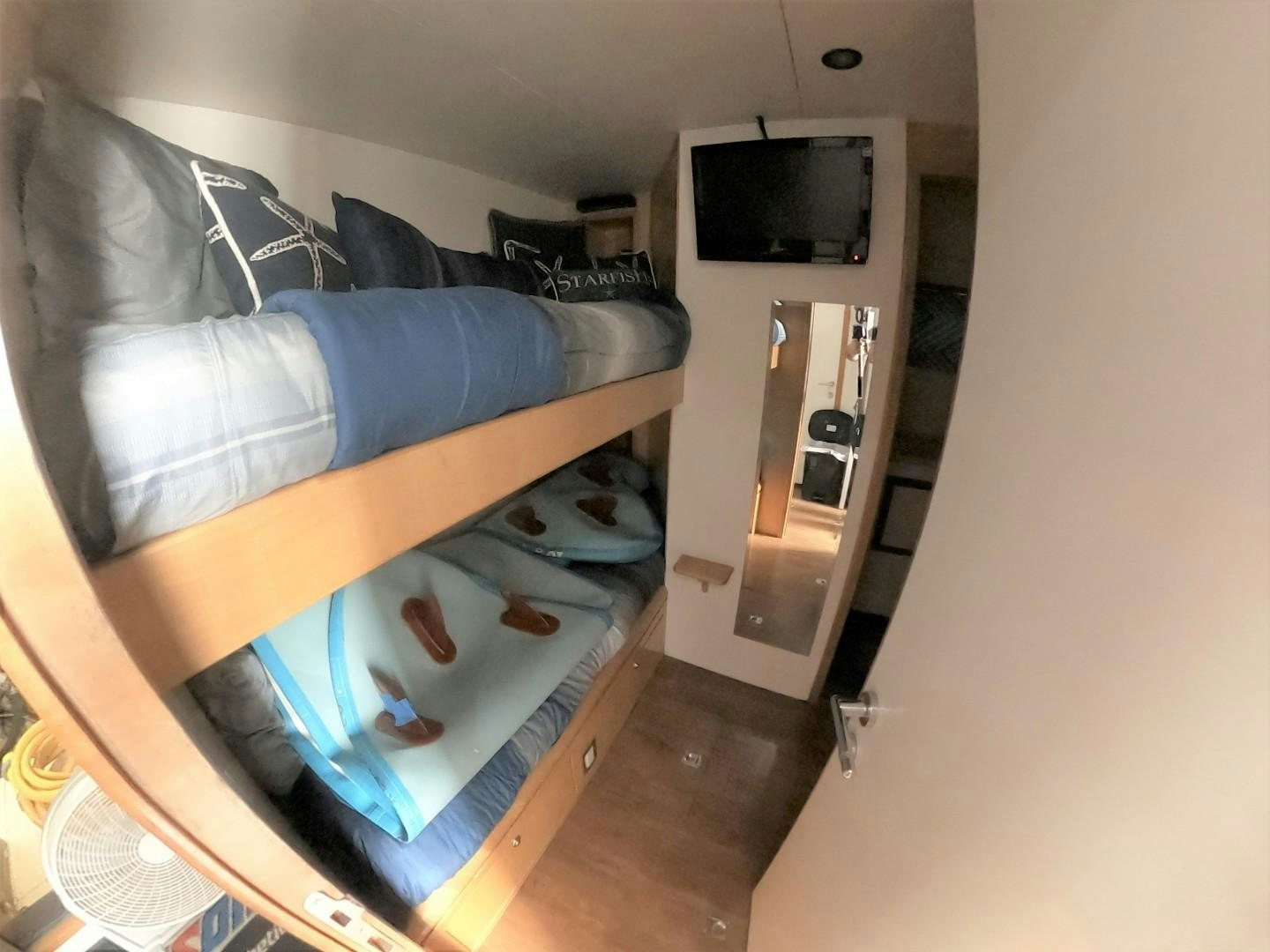a person lying on a bed aboard SEAS THE DAY Yacht for Sale