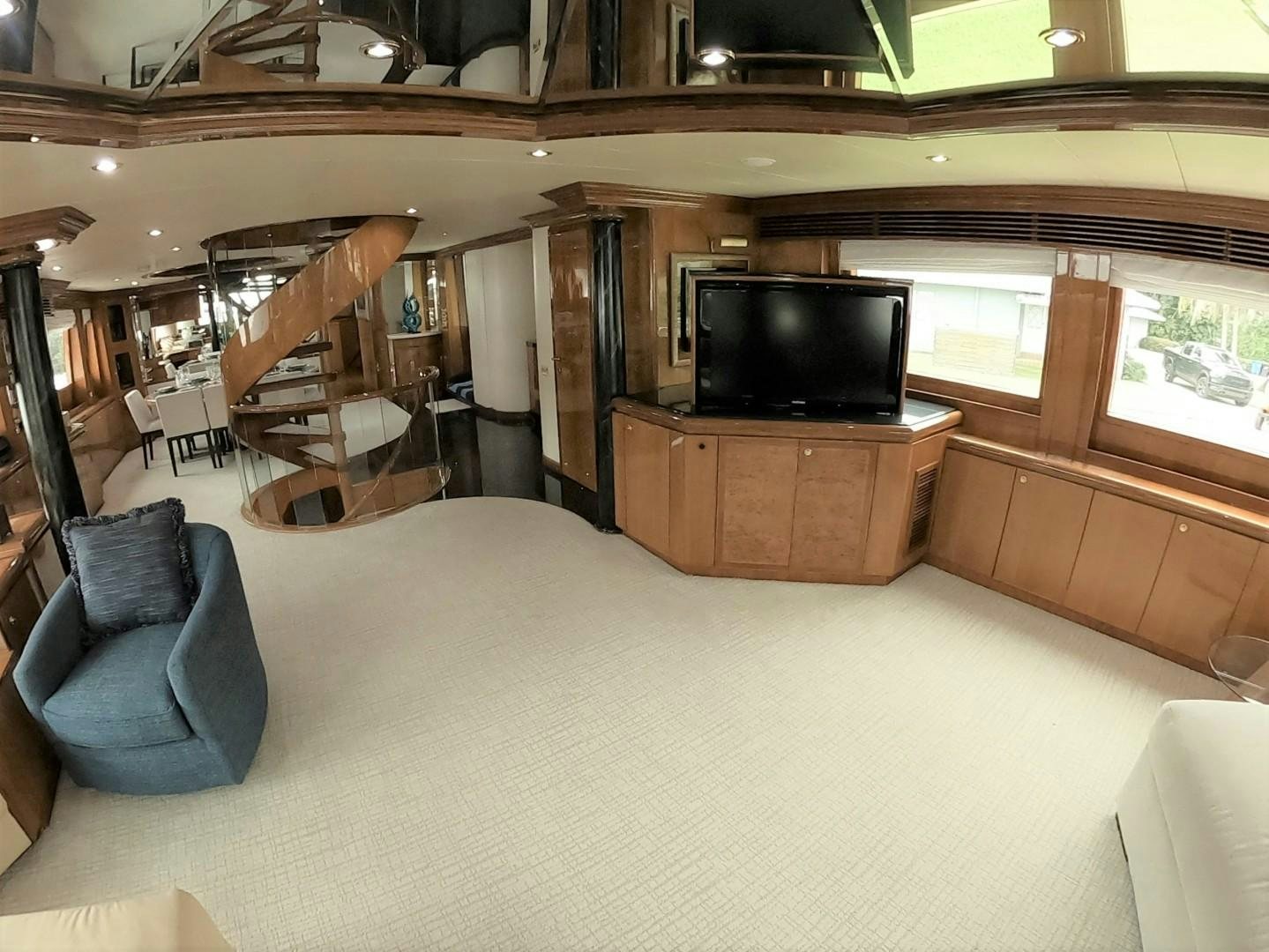 a room with a tv and a couch aboard SEAS THE DAY Yacht for Sale