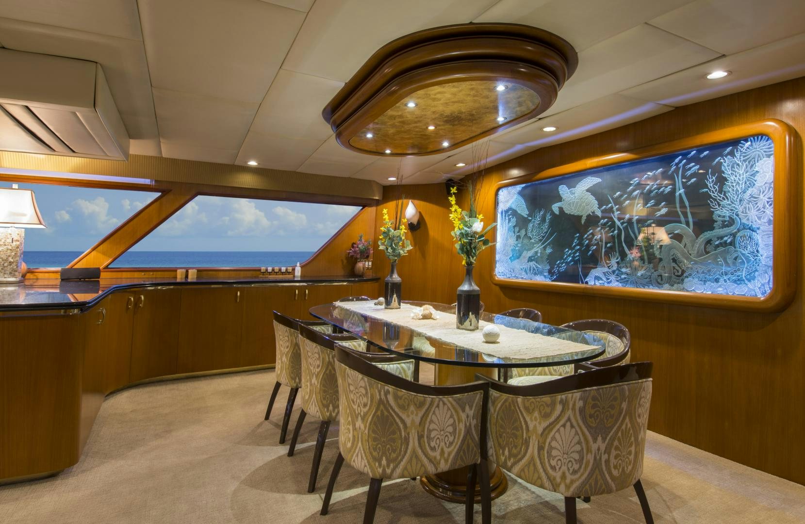 a room with a table and chairs aboard KALEEN Yacht for Sale