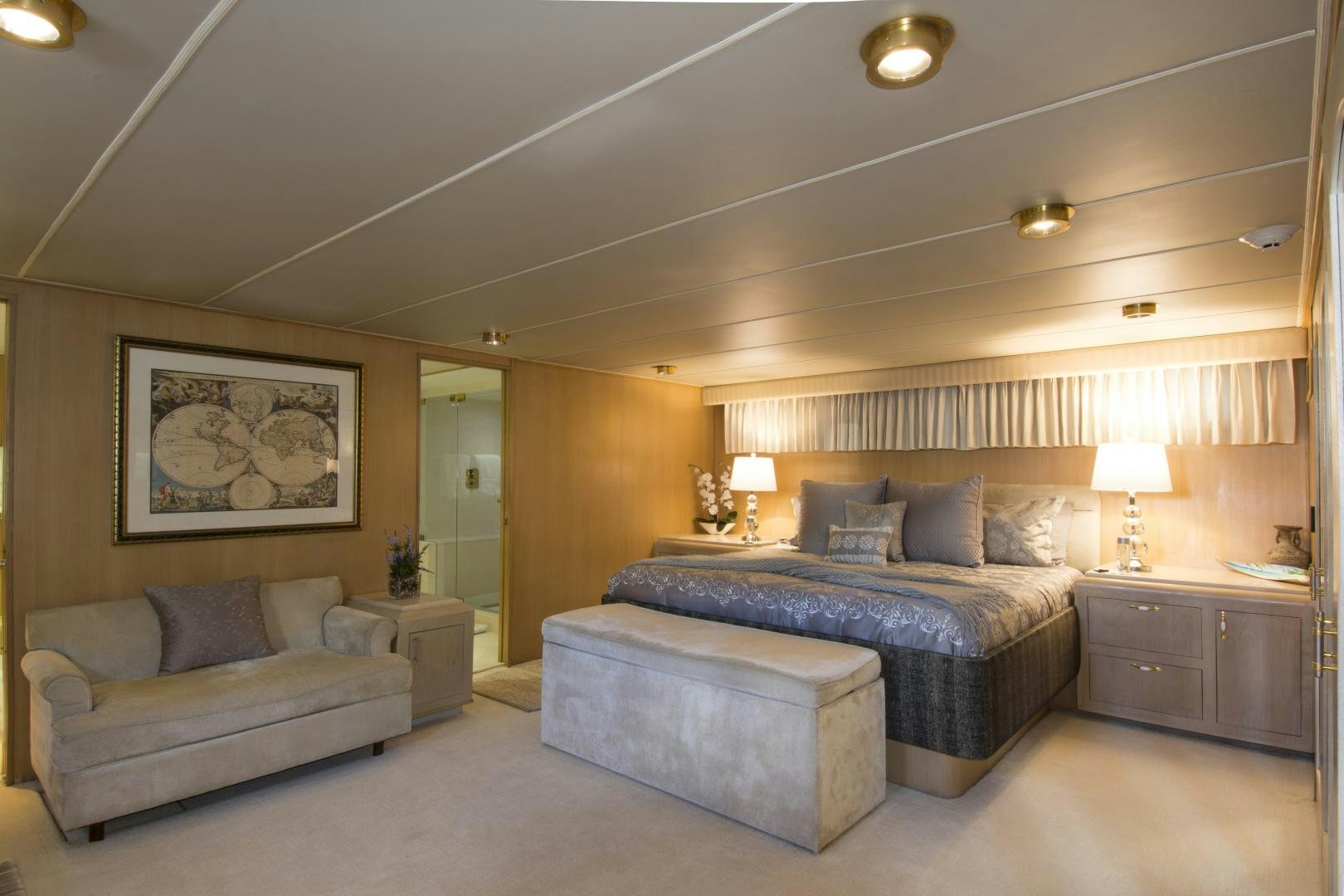 a bedroom with a bed and a couch aboard KALEEN Yacht for Sale