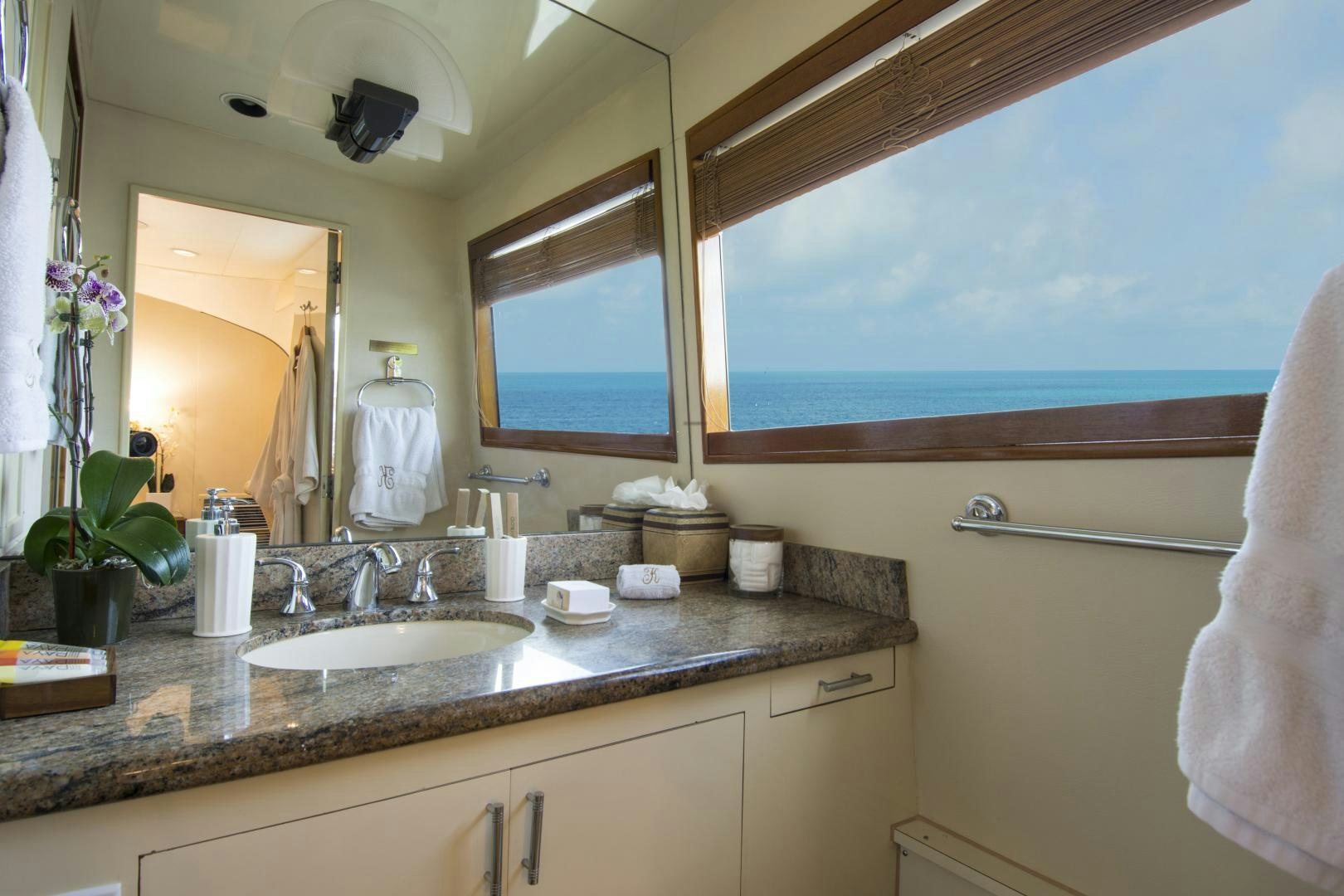 a bathroom with a sink and a mirror aboard KALEEN Yacht for Sale