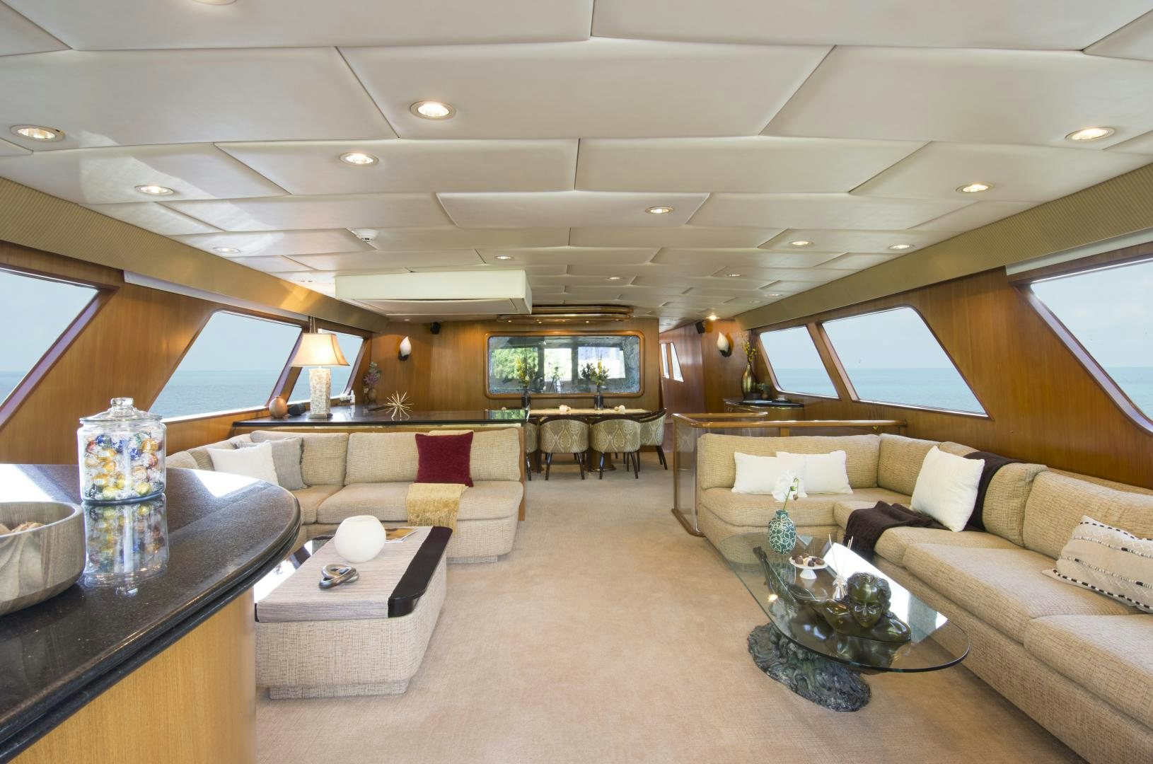 a living room with a large window aboard KALEEN Yacht for Sale