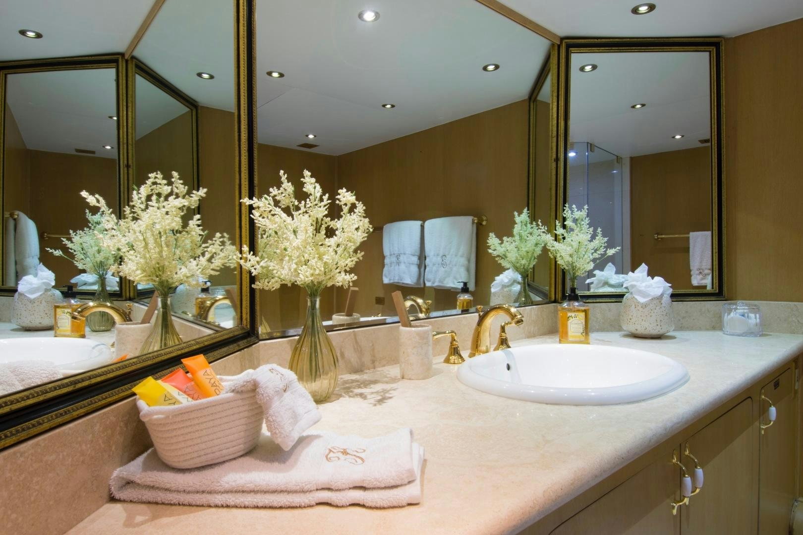 a bathroom with a large mirror aboard KALEEN Yacht for Sale