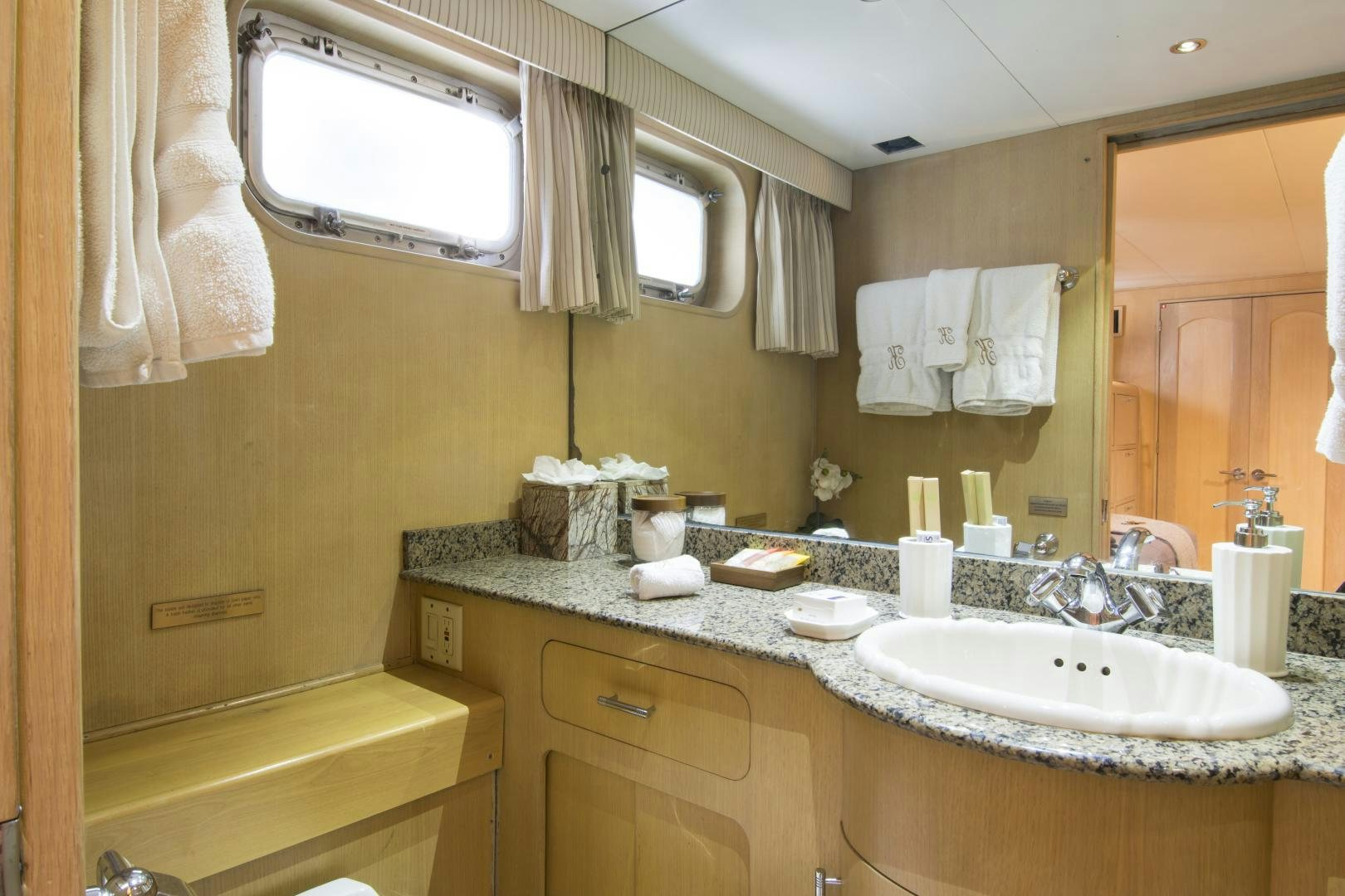 a bathroom with a large mirror aboard KALEEN Yacht for Sale