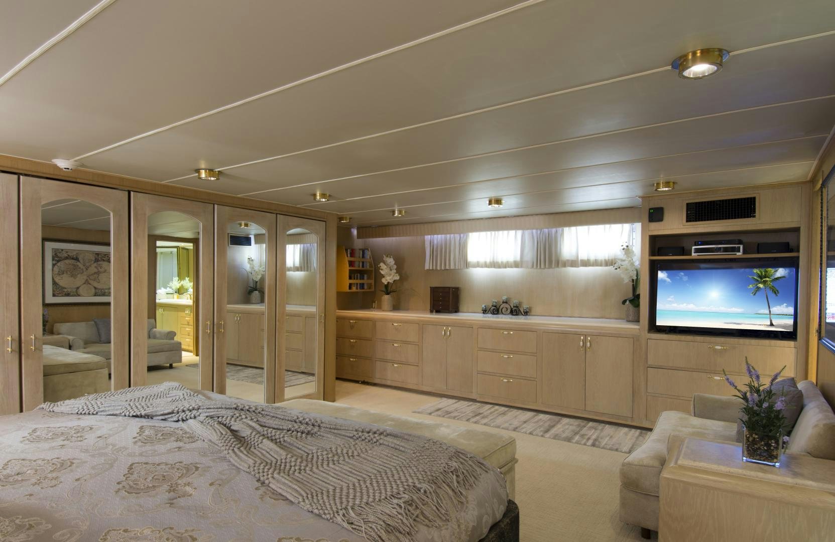 a bedroom with a large tv aboard KALEEN Yacht for Sale