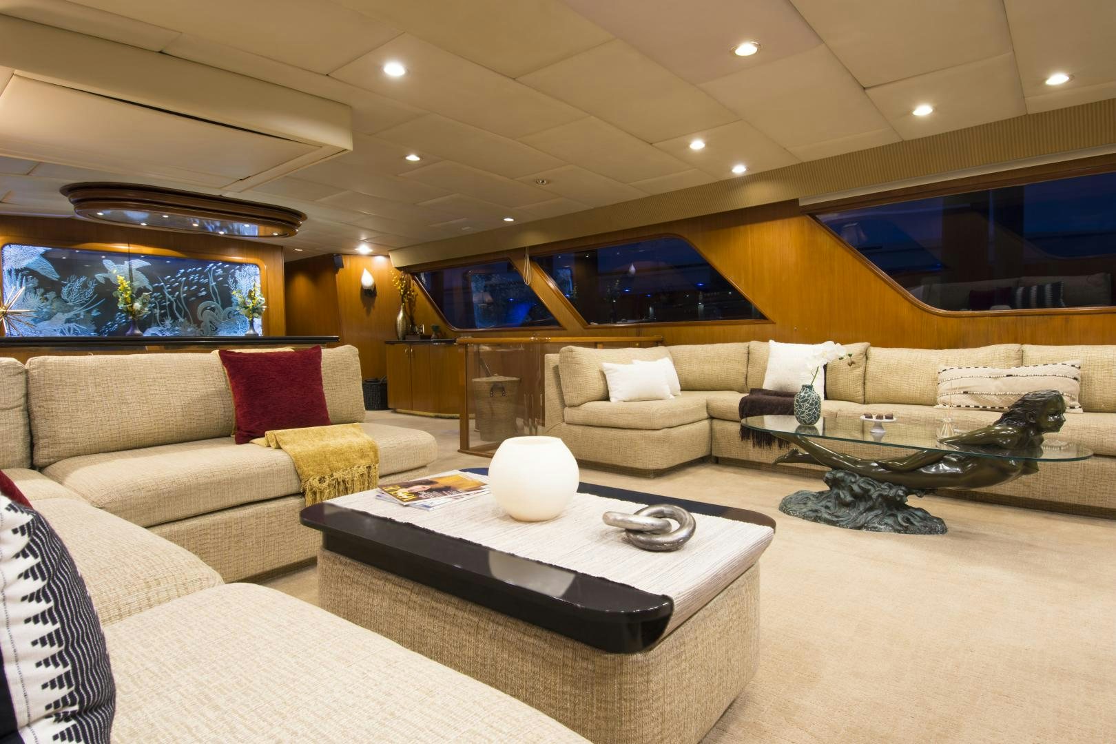a living room with a couch and a coffee table aboard KALEEN Yacht for Sale