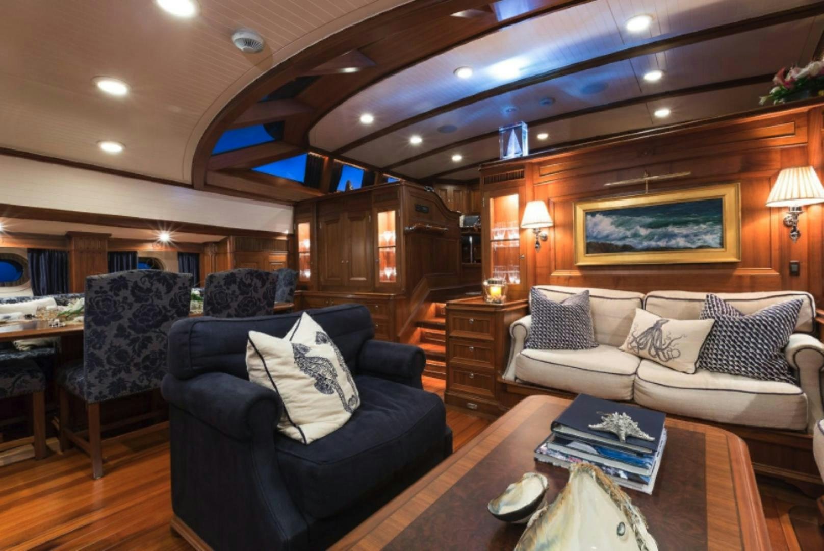 a living room with a couch and a coffee table aboard MARAE Yacht for Sale