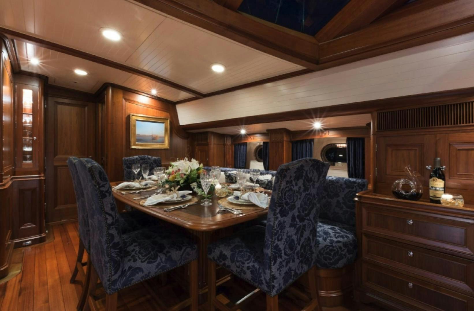 a dining room with a table and chairs aboard MARAE Yacht for Sale