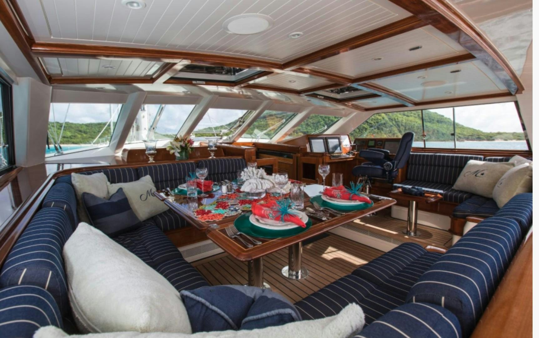 a living room with a large open window aboard MARAE Yacht for Sale