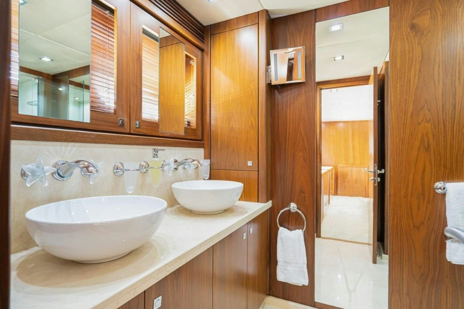 a bathroom with a sink and a mirror aboard DOUBLE D Yacht for Sale