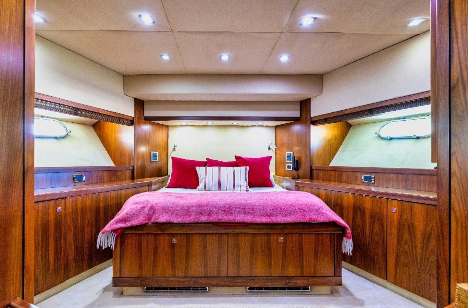 a bed in a room aboard DOUBLE D Yacht for Sale