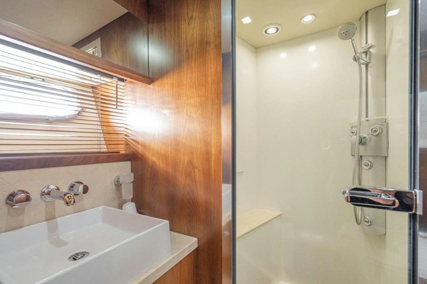 a bathroom with a sink and a shower aboard DOUBLE D Yacht for Sale
