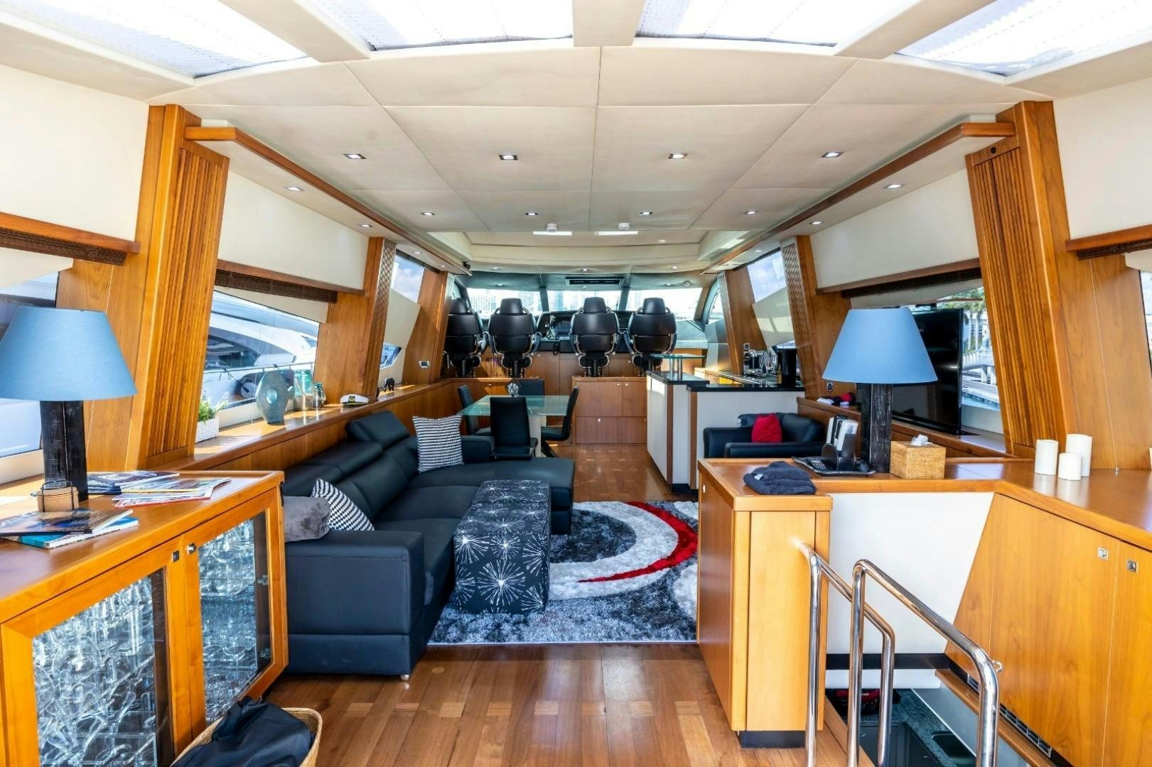 a living room with a couch and a table aboard DOUBLE D Yacht for Sale