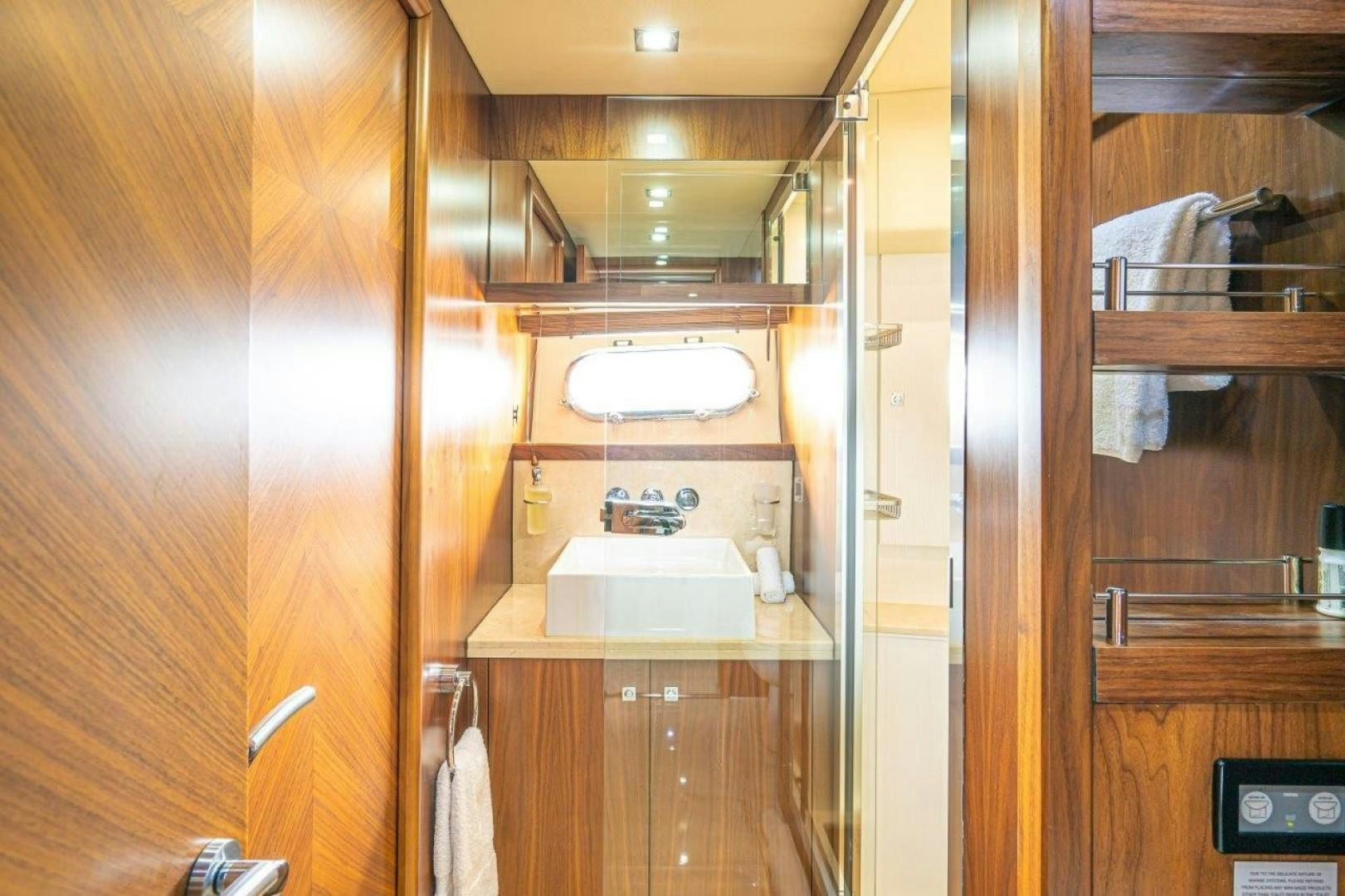 a bathroom with a sink and a mirror aboard DOUBLE D Yacht for Sale