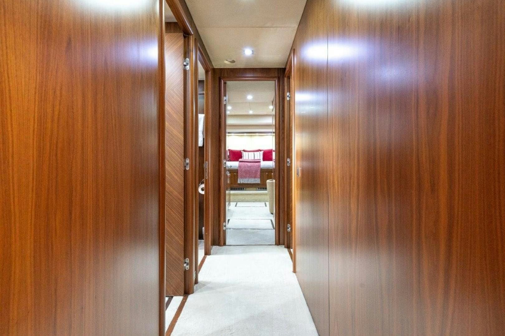 a hallway with wooden doors aboard DOUBLE D Yacht for Sale