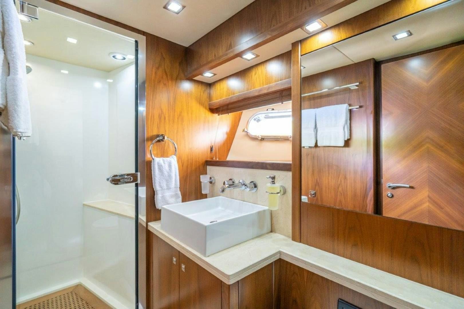 a bathroom with a sink and a mirror aboard DOUBLE D Yacht for Sale