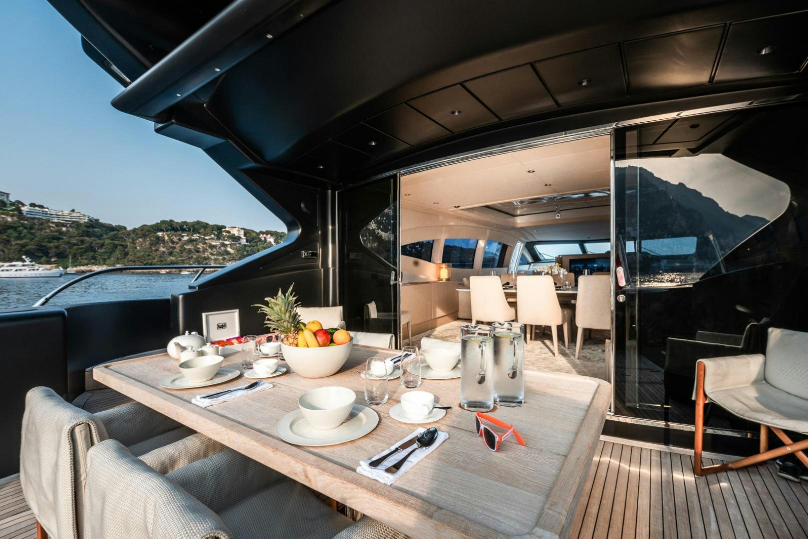 a table with cups and plates on it aboard NEOPRENE  Yacht for Sale