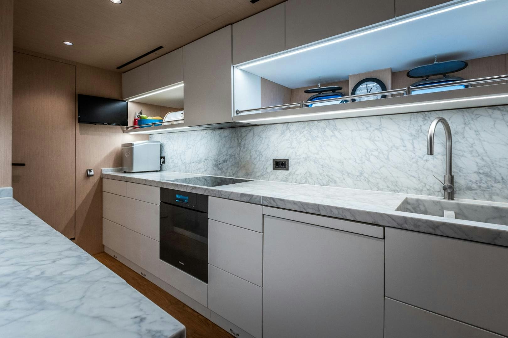a kitchen with white cabinets aboard NEOPRENE  Yacht for Sale