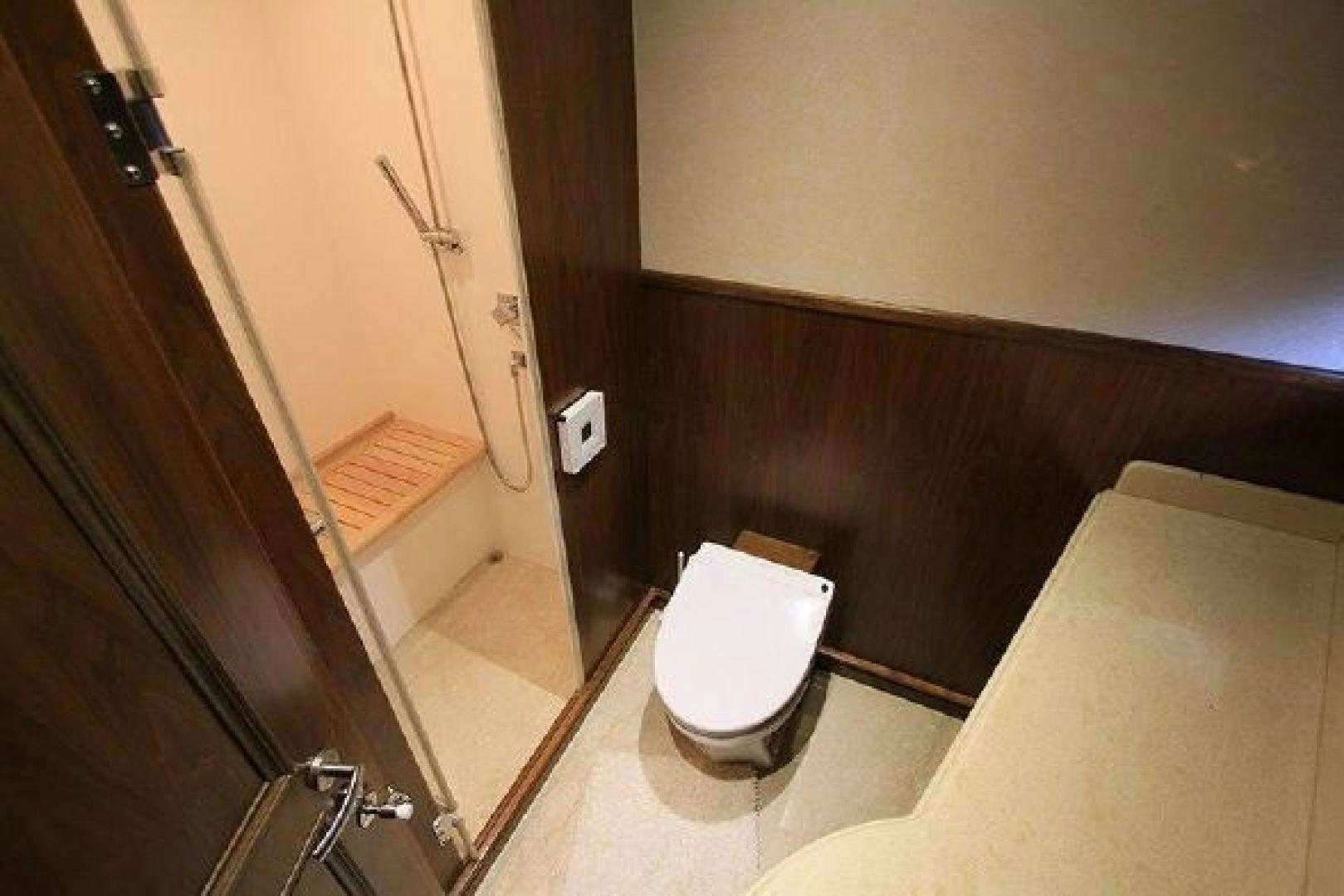 a bathroom with a toilet aboard WHITE LOTUS VIII Yacht for Sale