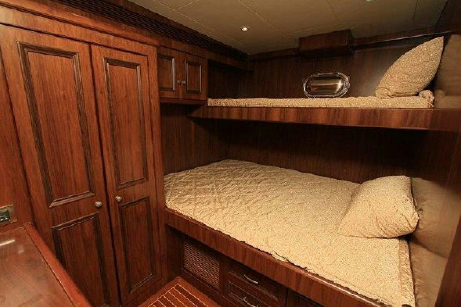 a bed in a room aboard WHITE LOTUS VIII Yacht for Sale
