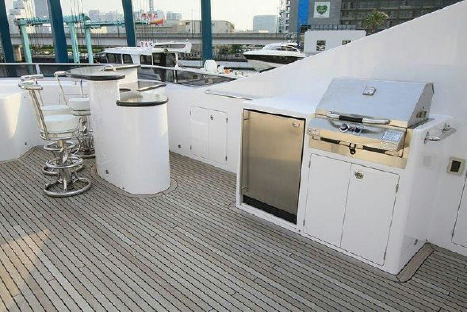 a room with white cabinets and a white container on a wooden floor aboard WHITE LOTUS VIII Yacht for Sale