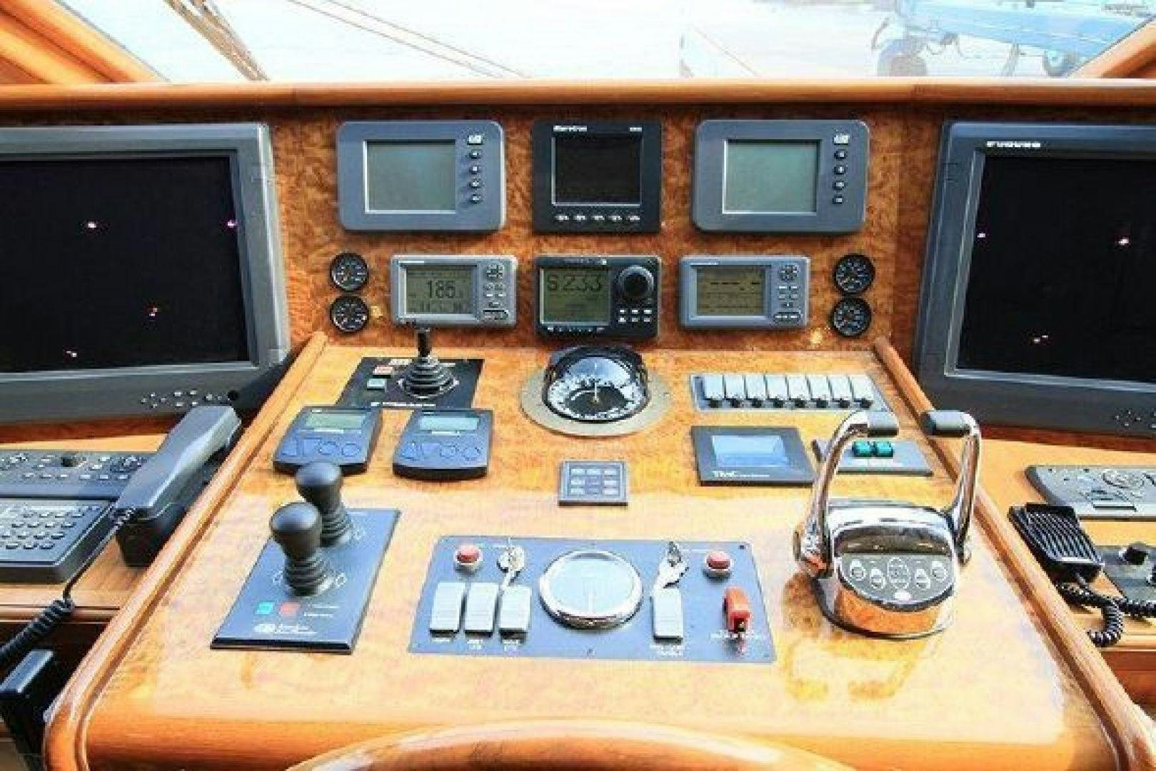 a wooden panel with electronic equipment aboard WHITE LOTUS VIII Yacht for Sale