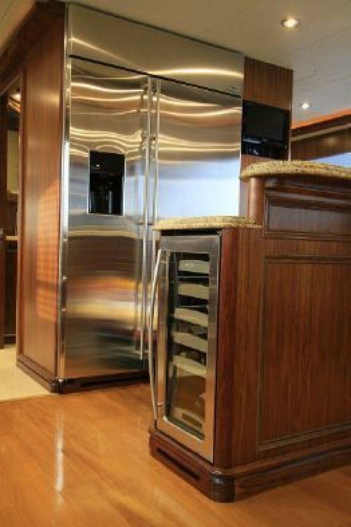 a large cabinet with a glass door aboard WHITE LOTUS VIII Yacht for Sale