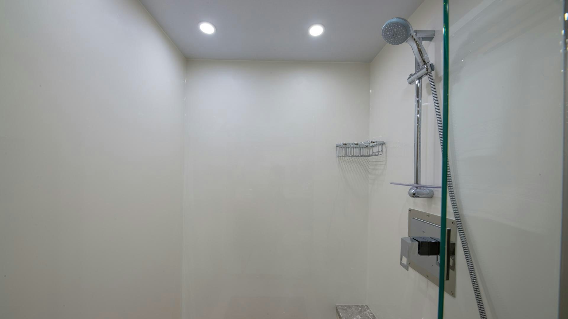 a shower unit in a bathroom aboard RISK TAKER Yacht for Sale