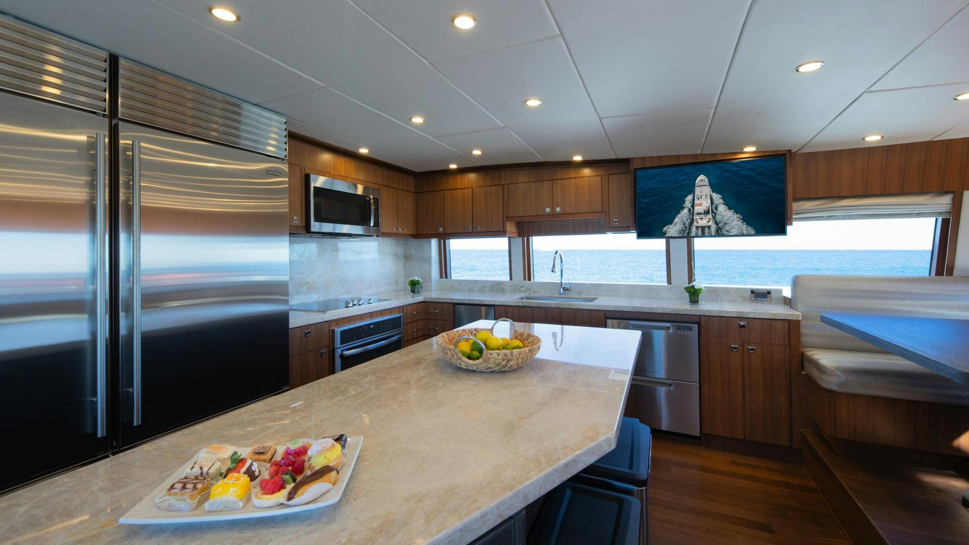 a kitchen with a large island aboard RISK TAKER Yacht for Charter