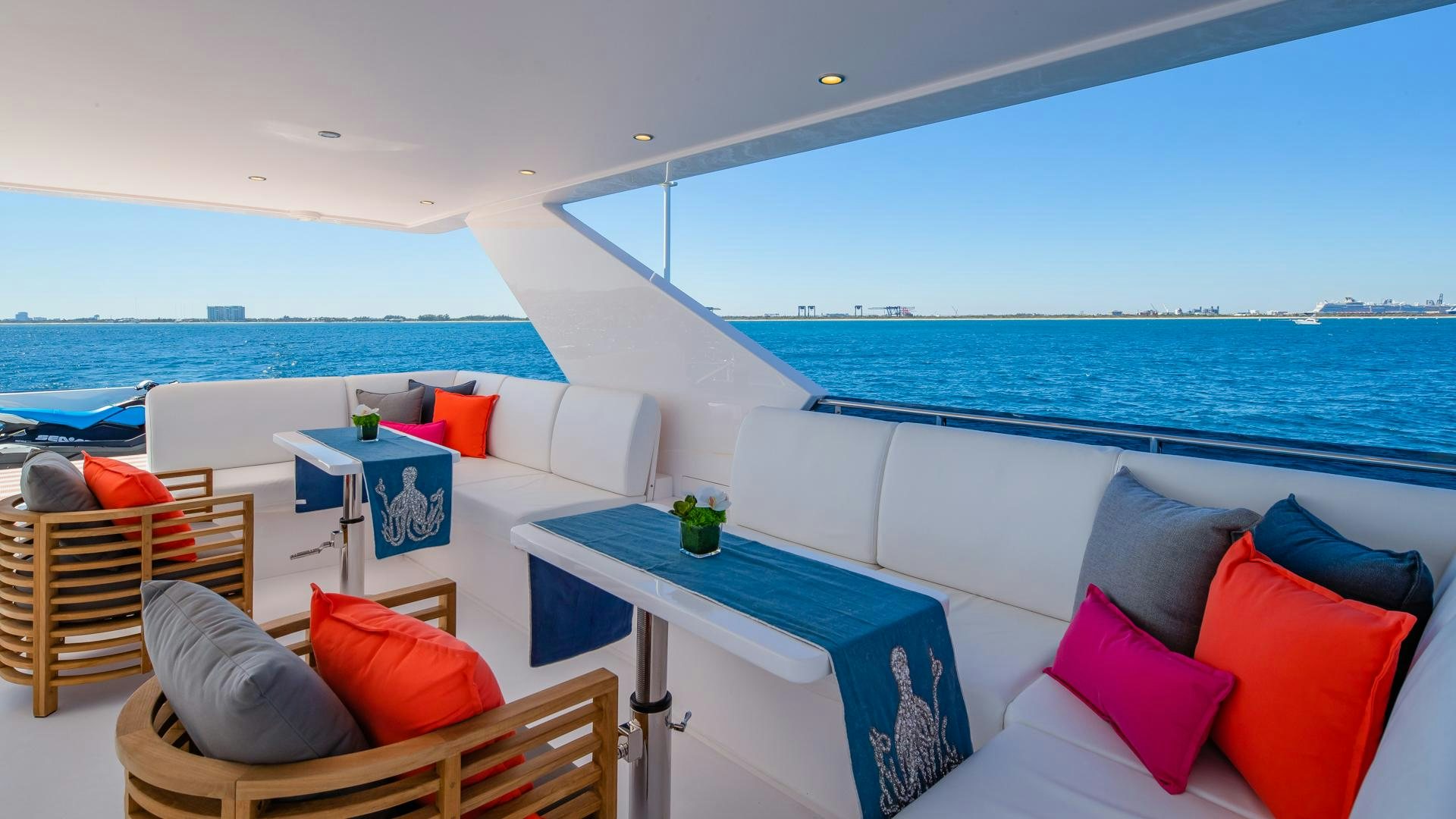 a room with a table and chairs aboard RISK TAKER Yacht for Charter