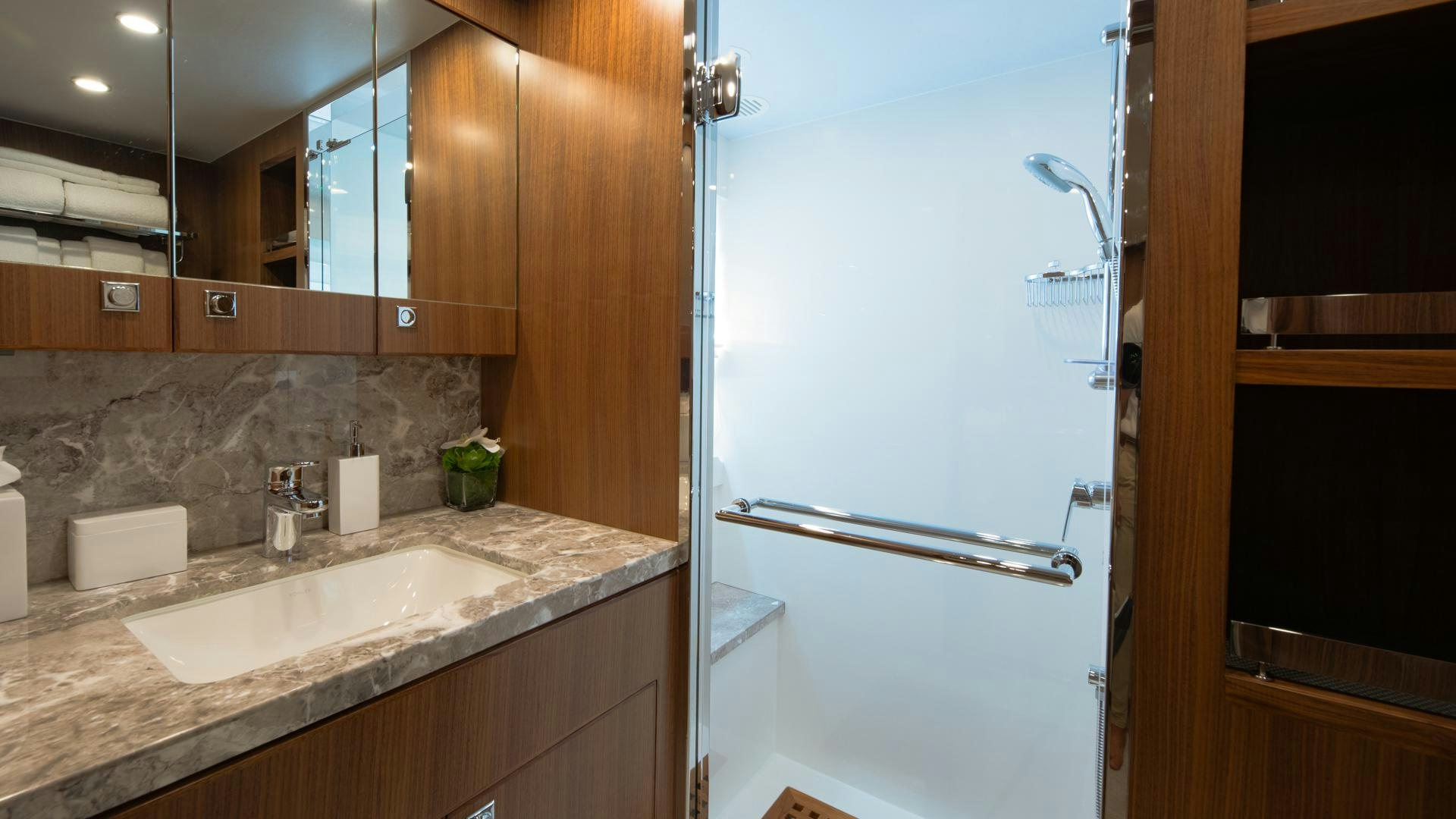 a kitchen with a large refrigerator aboard RISK TAKER Yacht for Sale