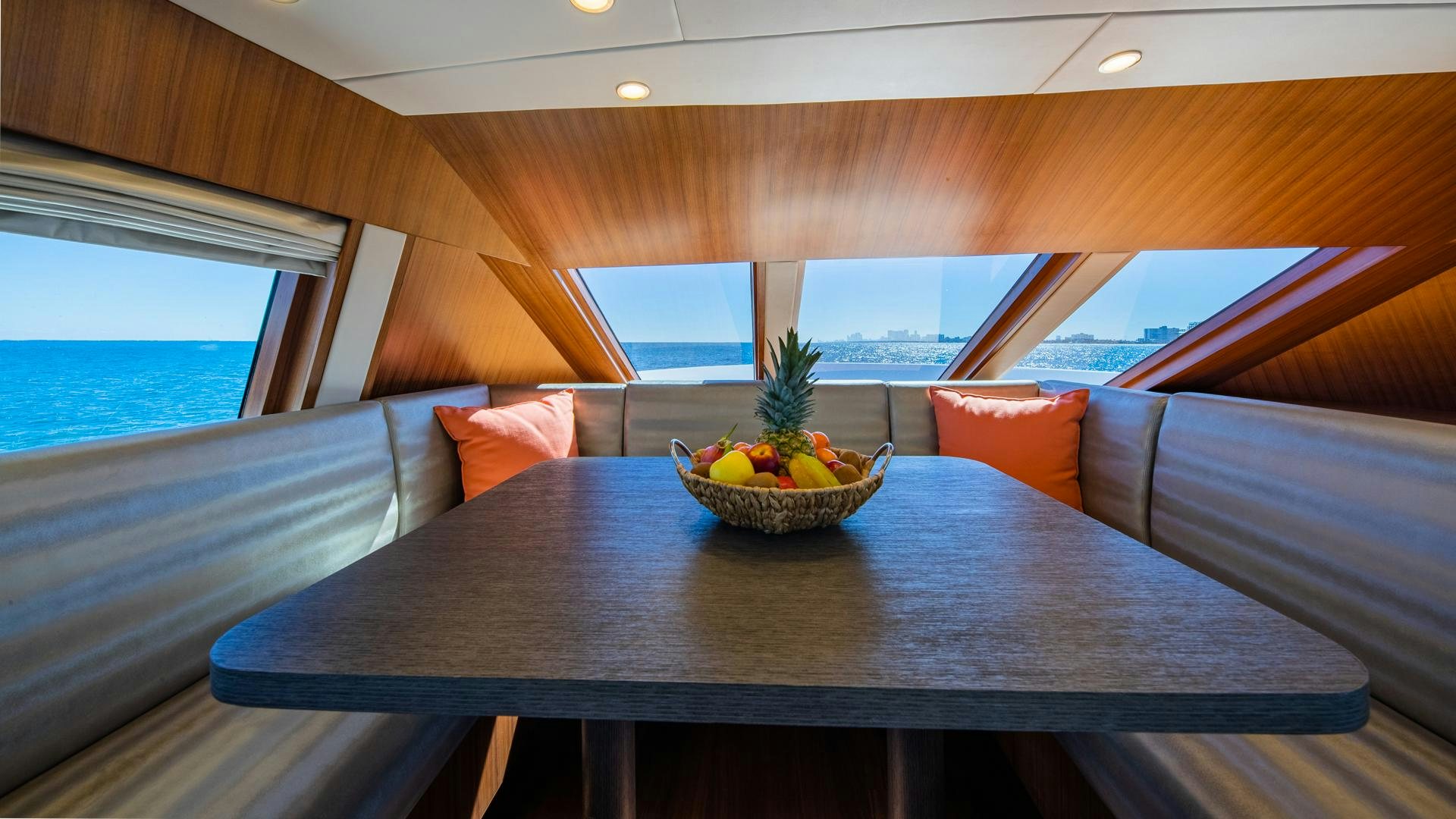 a bowl of fruit on a table aboard RISK TAKER Yacht for Sale