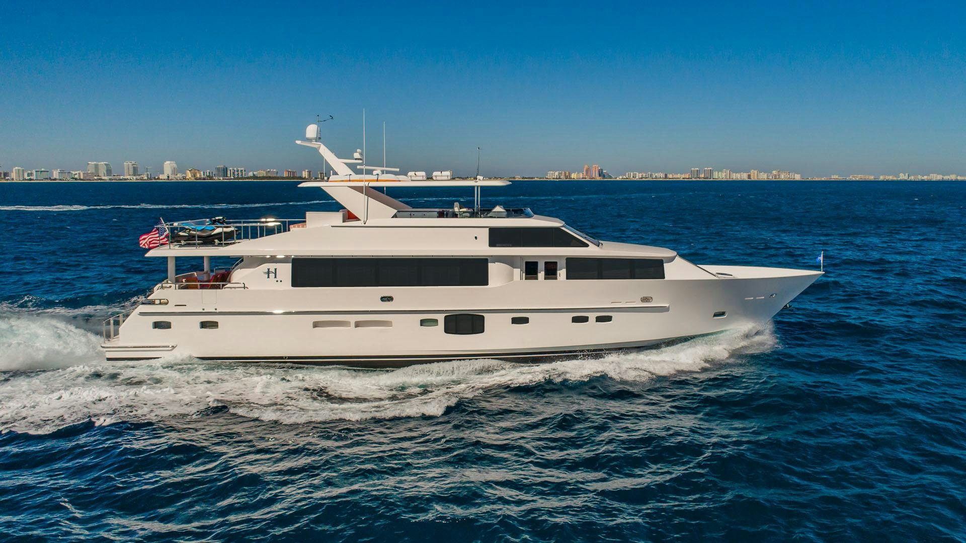 a white yacht on the water aboard RISK TAKER Yacht for Charter