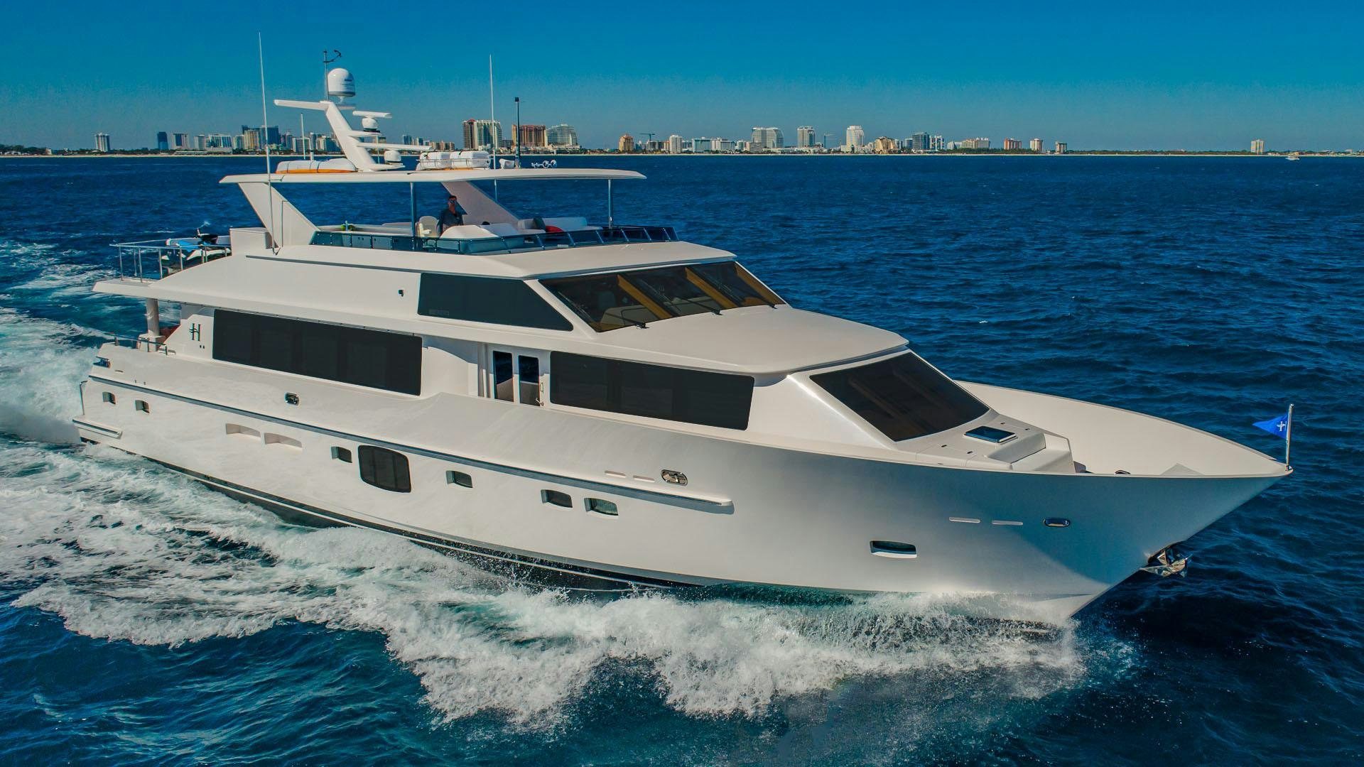 a white yacht on the water aboard RISK TAKER Yacht for Sale