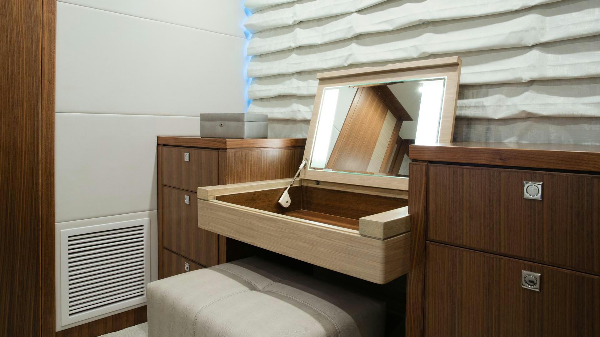 a room with a bed and a dresser aboard RISK TAKER Yacht for Sale