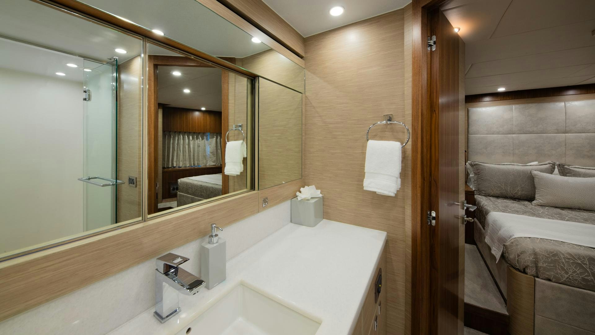 a bathroom with a large mirror aboard RISK TAKER Yacht for Sale