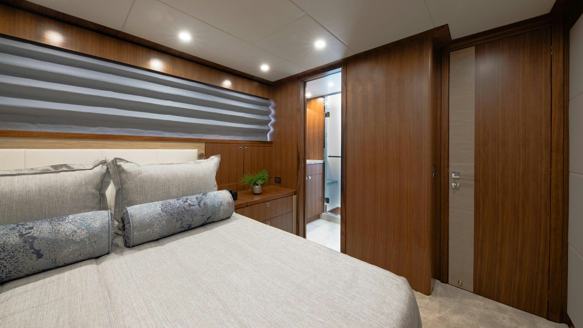 a room with a bed and a couch aboard RISK TAKER Yacht for Sale