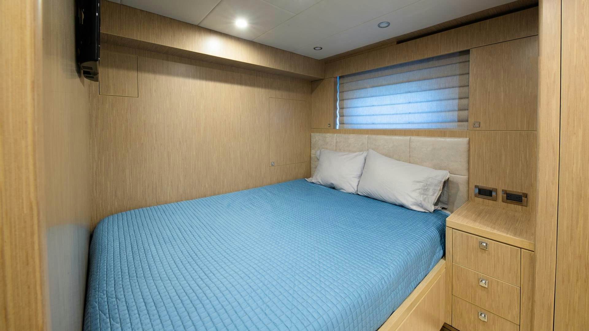 a bed in a room aboard RISK TAKER Yacht for Sale