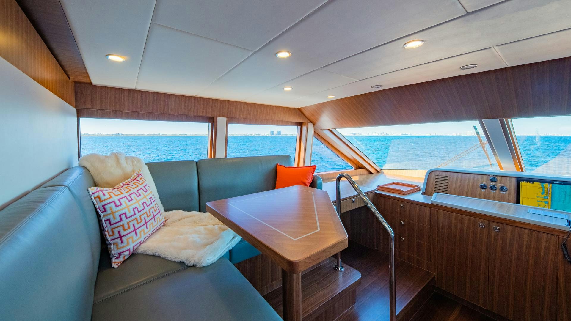 a boat with a table and chairs aboard RISK TAKER Yacht for Sale