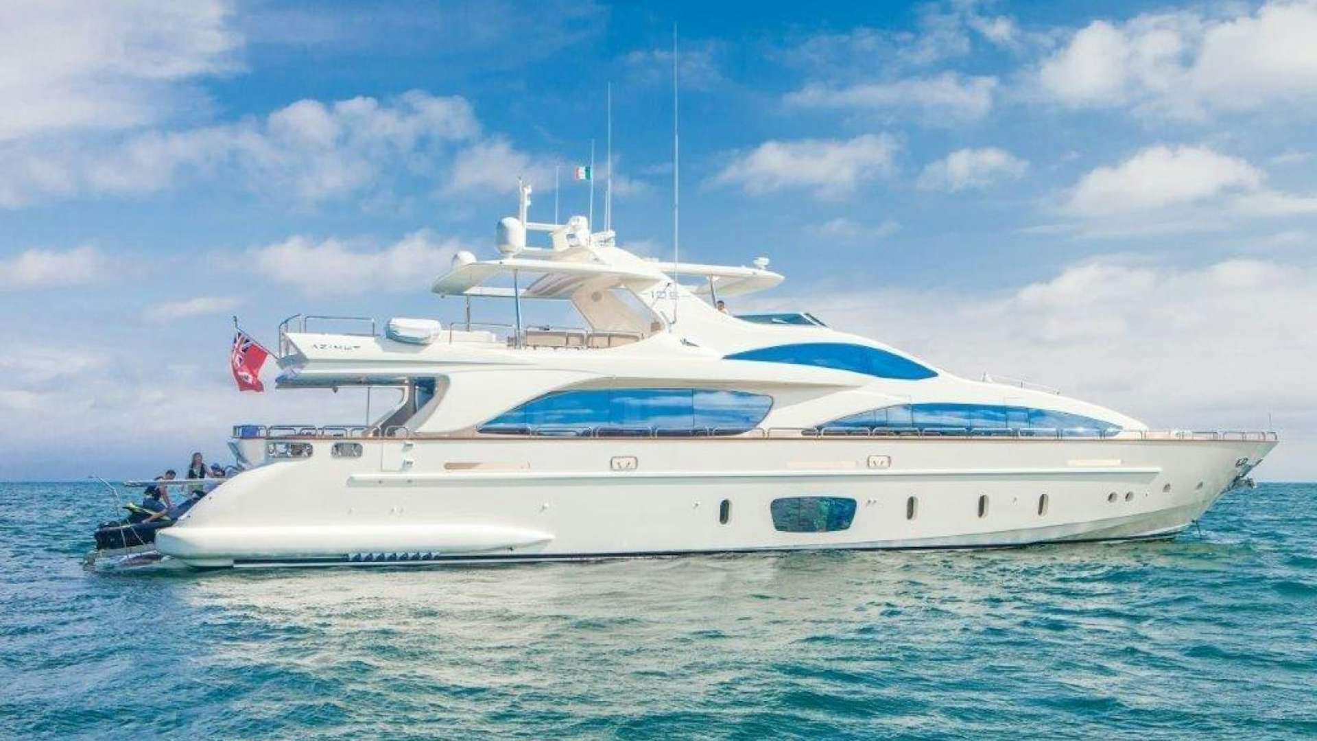 a white yacht in the water aboard AMANECER Yacht for Sale
