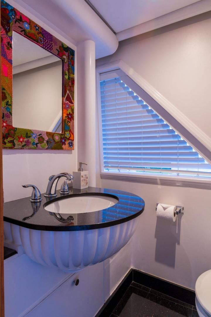 a bathroom with a sink and a mirror aboard PIRATE RADIO Yacht for Sale