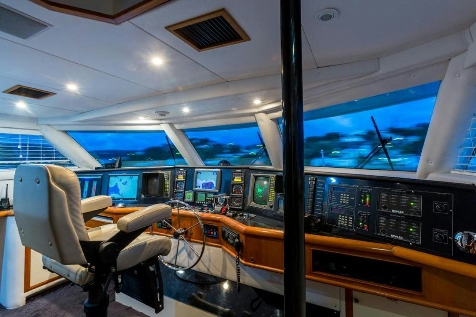 inside of a vehicle with monitors and chairs aboard PIRATE RADIO Yacht for Sale