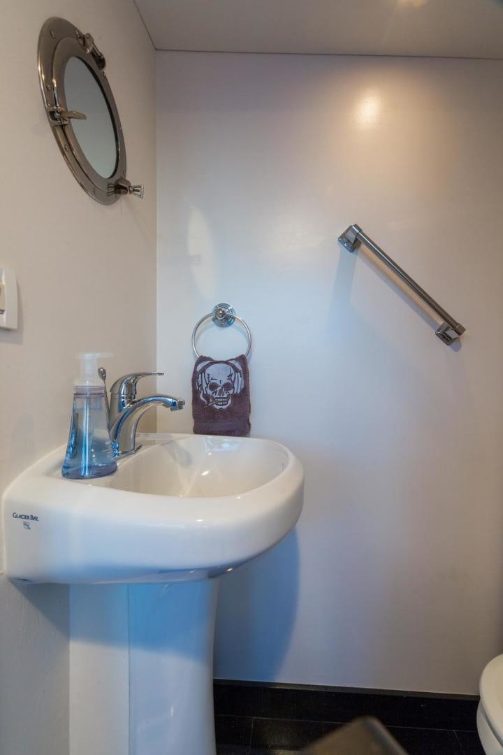 a sink and mirror in a bathroom aboard PIRATE RADIO Yacht for Sale